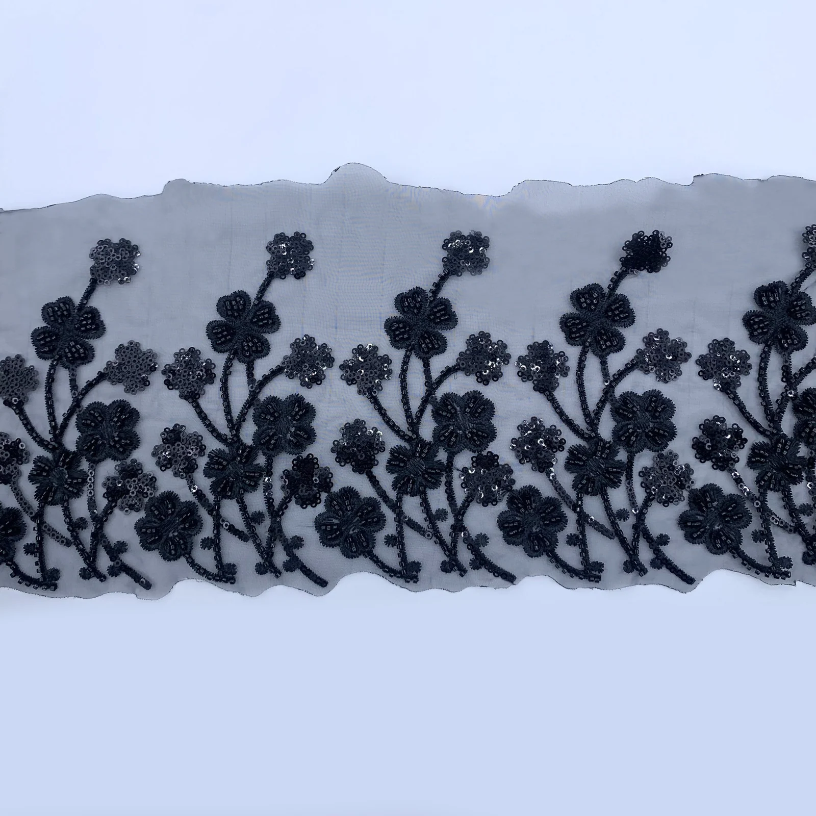 Black Branch Blossom Mesh Border — Photographed decorative trim sample; verify colour and construction with a physical sample