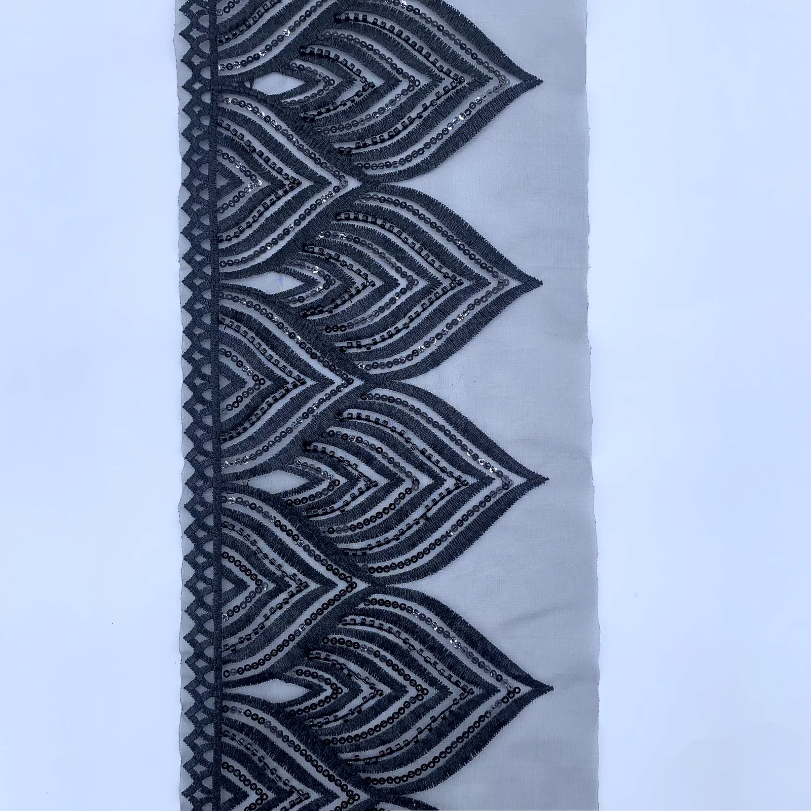 Black Layered Chevron Mesh Trim — Photographed decorative trim sample; verify colour and construction with a physical sample