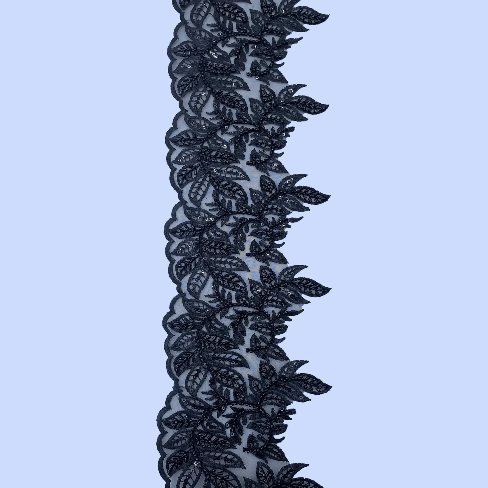 Black Leafy Scroll Mesh Trim — Photographed decorative trim sample; verify colour and construction with a physical sample