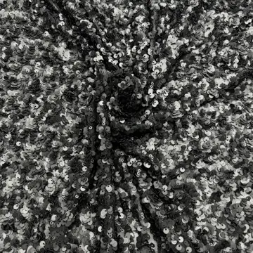 Black and Silver Mixed Disc Sequin Fabric — Close-up of the photographed surface