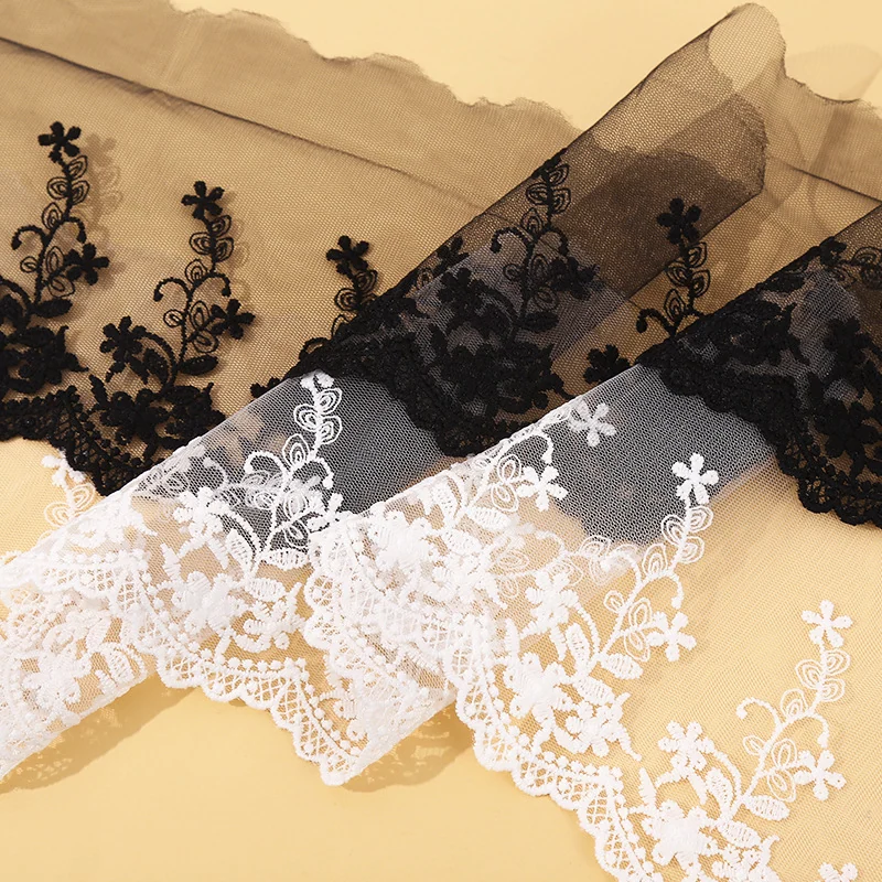 Black and White Floral Scallop Mesh Trim — Photographed decorative trim sample; verify colour and construction with a physical sample