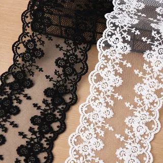 Black and White Floral Scalloped Net Border — Photographed decorative trim sample; verify colour and construction with a physical sample