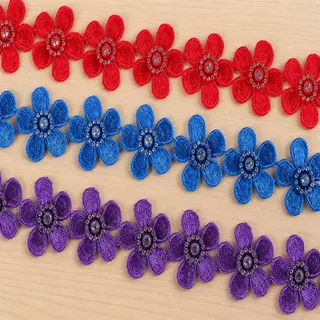 Bright multicolour circular flowers decorative trim — Photographed decorative trim sample; verify colour and construction with a physical sample