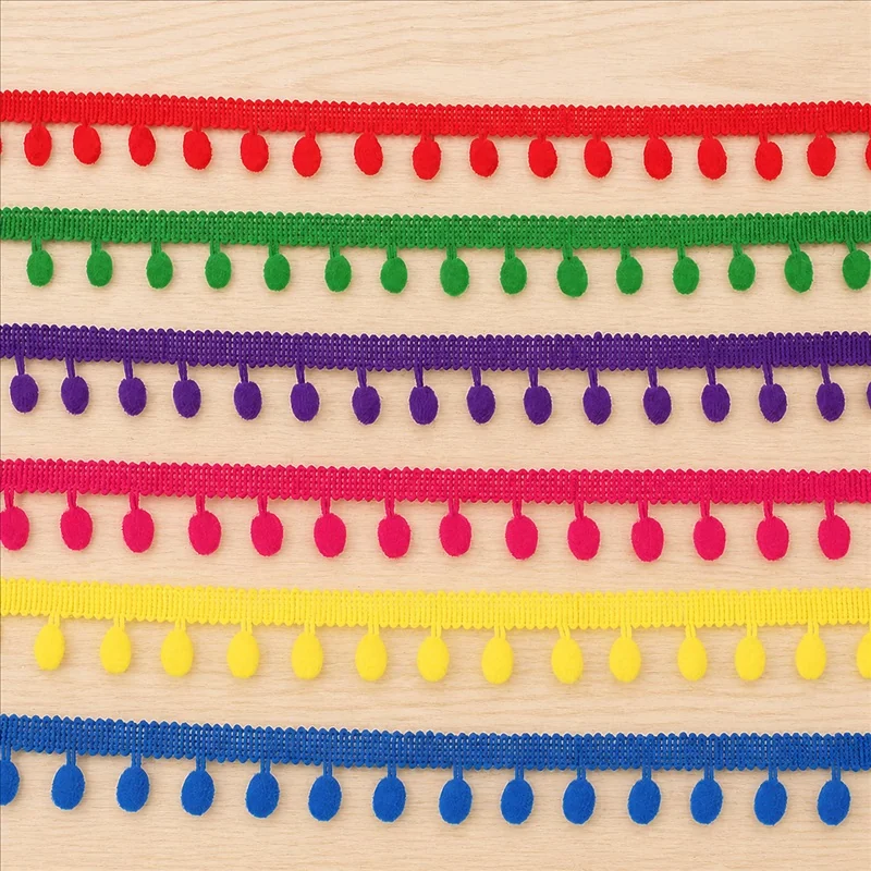 Bright Pom-Drop Ribbon Trim — Photographed decorative trim sample; verify colour and construction with a physical sample