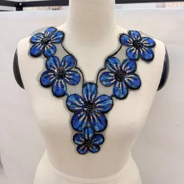 Colourful Floral Neckline Panel — Neckline panel placed on a dress form; not a finished garment