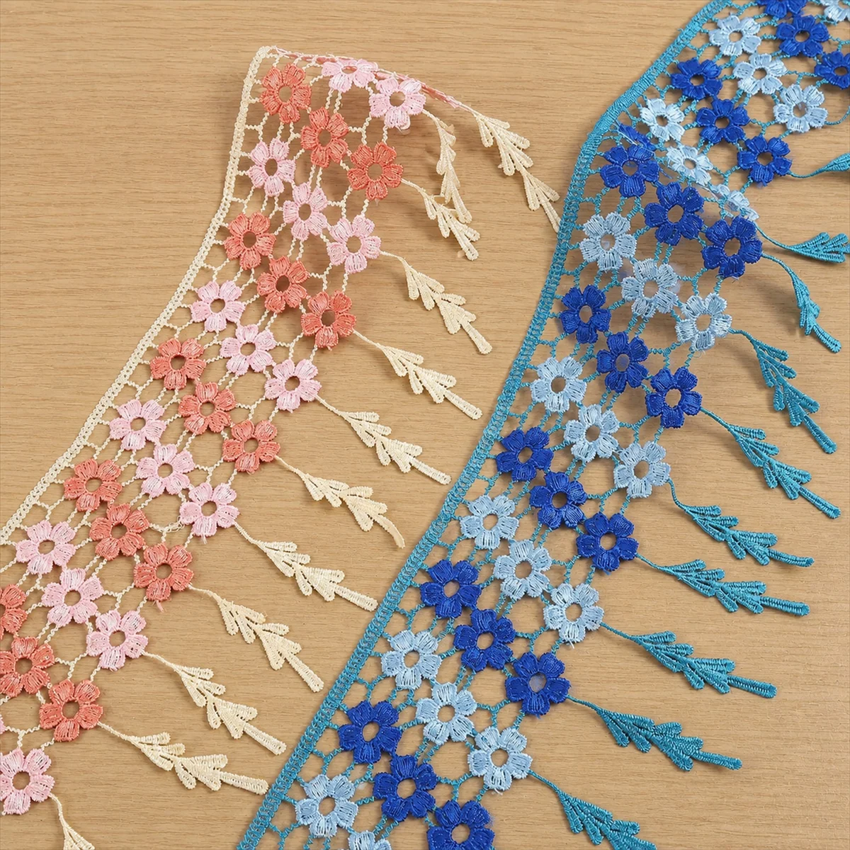 Coral and Blue Floral Fringe Mesh Border — Photographed decorative trim sample; verify colour and construction with a physical sample