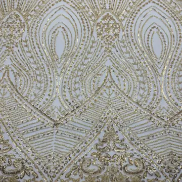 Gold Ornamental Sequin Mesh Fabric — Close-up of the photographed surface