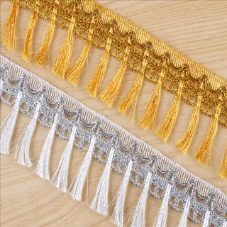 Gold and silver tassels fringe trim — Photographed decorative trim sample; verify colour and construction with a physical sample