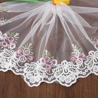 Ivory small flowers tulle trim — Photographed decorative trim sample; verify colour and construction with a physical sample