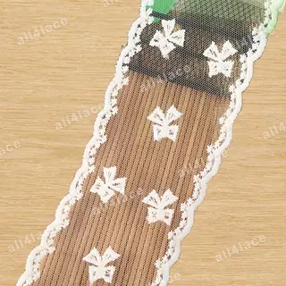 Ivory ribbon bows mesh trim