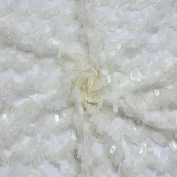 Ivory Wave Sequin Textured Fabric — Close-up of the photographed surface