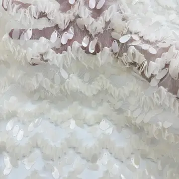 Ivory Wave Sequin Textured Fabric — Sample draped for visual reference