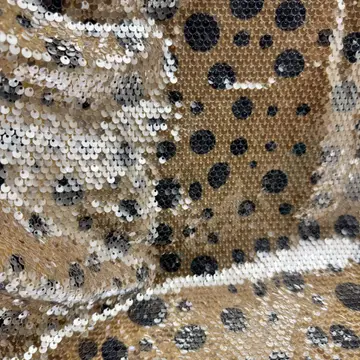 Metallic Leopard Spot Sequin Fabric — Folded sample showing surface and base