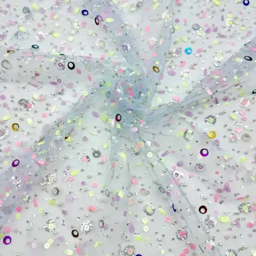 Mixed-Shape Sequin Sheer Fabric — Close-up of the photographed surface