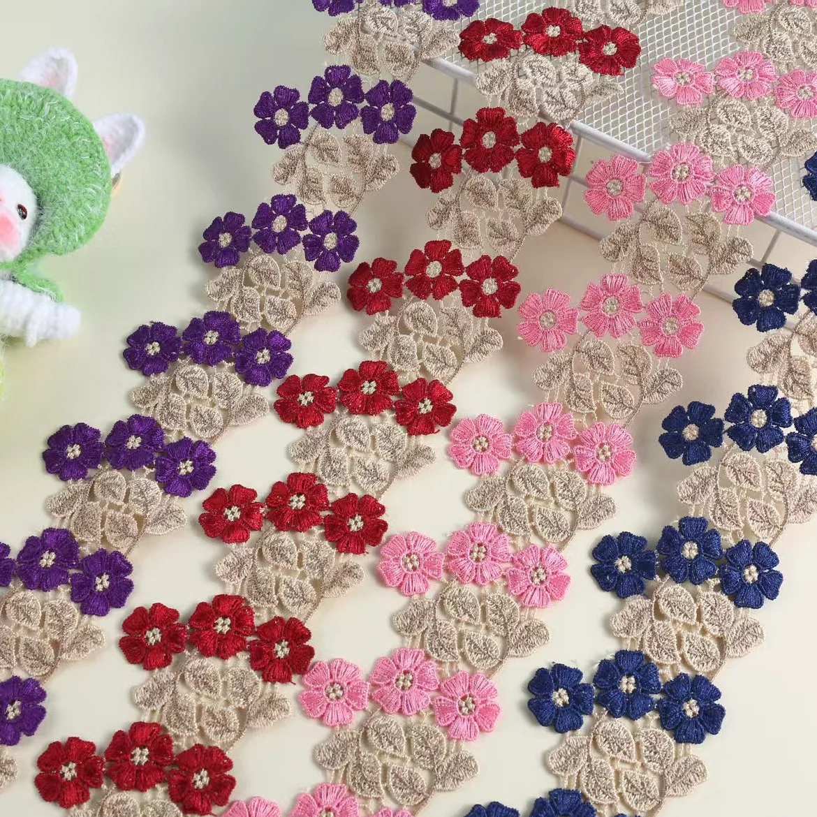 Multicolour Three-Flower Cluster Trim — Photographed decorative trim sample; verify colour and construction with a physical sample