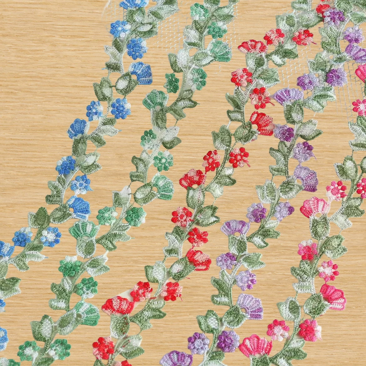 Multicolour Twining Flower Vine Trim — Photographed decorative trim sample; verify colour and construction with a physical sample