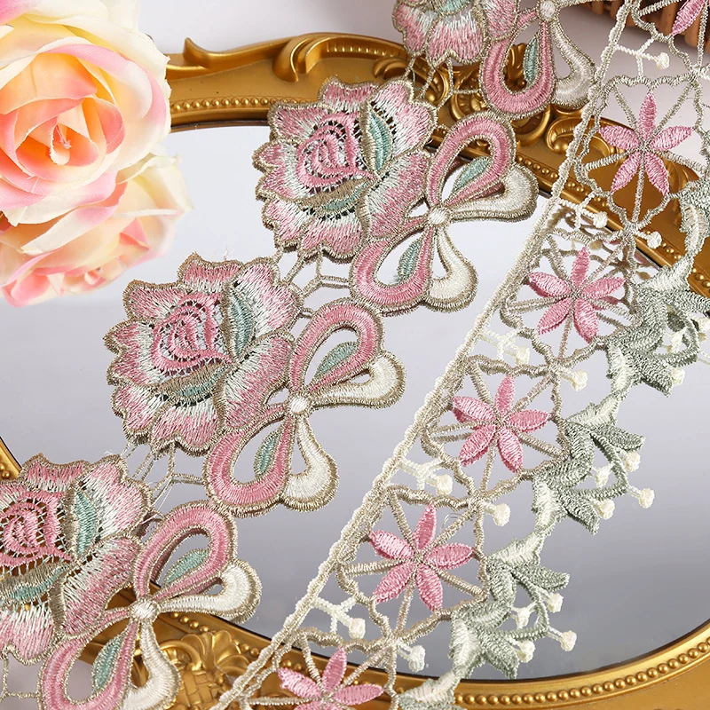 Soft pastel large blooms lace trim — Photographed decorative trim sample; verify colour and construction with a physical sample