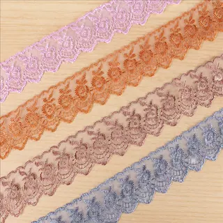 Soft pastel metallic flowers lace trim — Photographed decorative trim sample; verify colour and construction with a physical sample