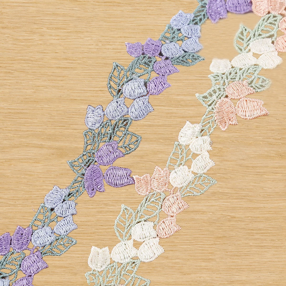 Pastel Tulip Leaf Vine Lace Trim — Photographed decorative trim sample; verify colour and construction with a physical sample