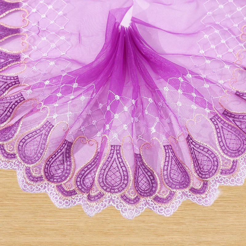 Purple scalloped floral border tulle trim — Photographed decorative trim sample; verify colour and construction with a physical sample