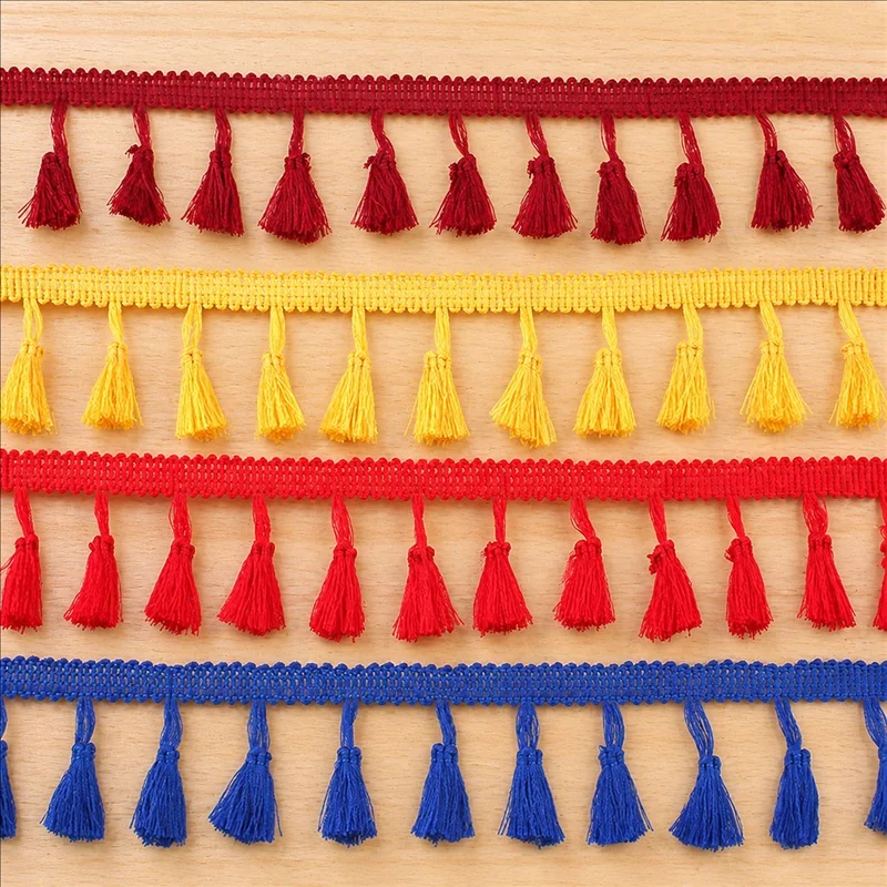 Rainbow tones wide tassels fringe trim — Photographed decorative trim sample; verify colour and construction with a physical sample