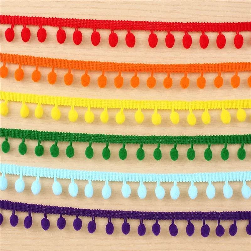 Rainbow tones small pom-poms trim — Photographed decorative trim sample; verify colour and construction with a physical sample