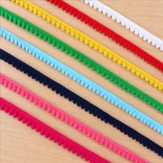 Rainbow tones pom-pom line trim — Photographed decorative trim sample; verify colour and construction with a physical sample