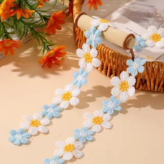 White leaf vine lace trim — Photographed decorative trim sample; verify colour and construction with a physical sample